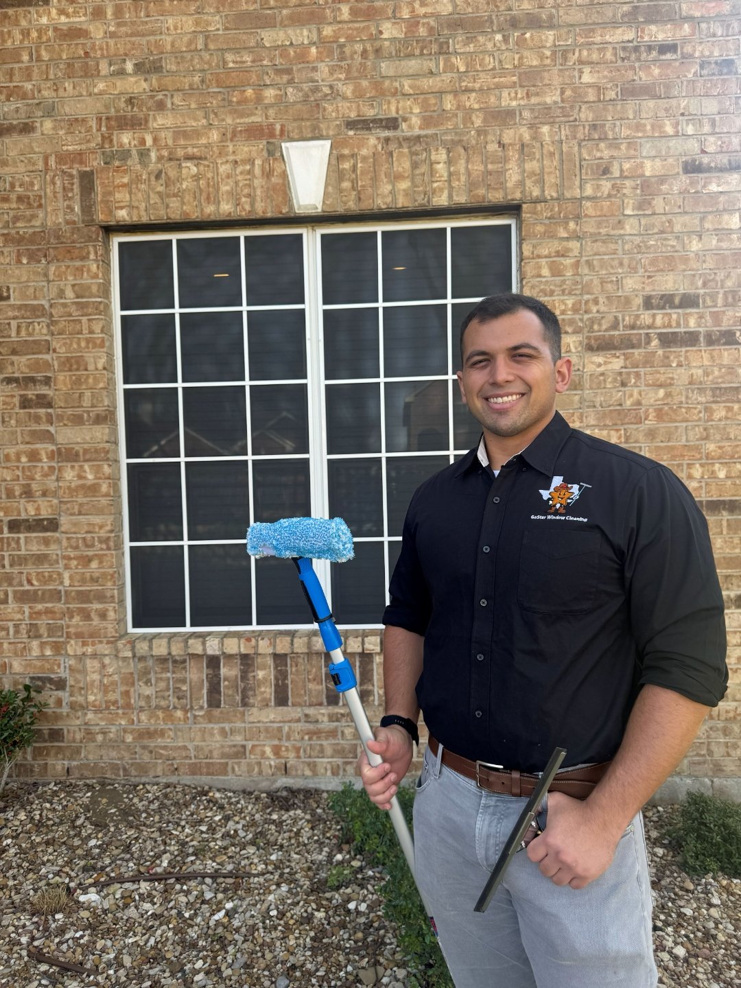 Brady Ellis, owner of GoStar Window Cleaning, with professional equipment